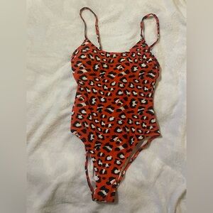Red cheetah print one piece swimsuit.